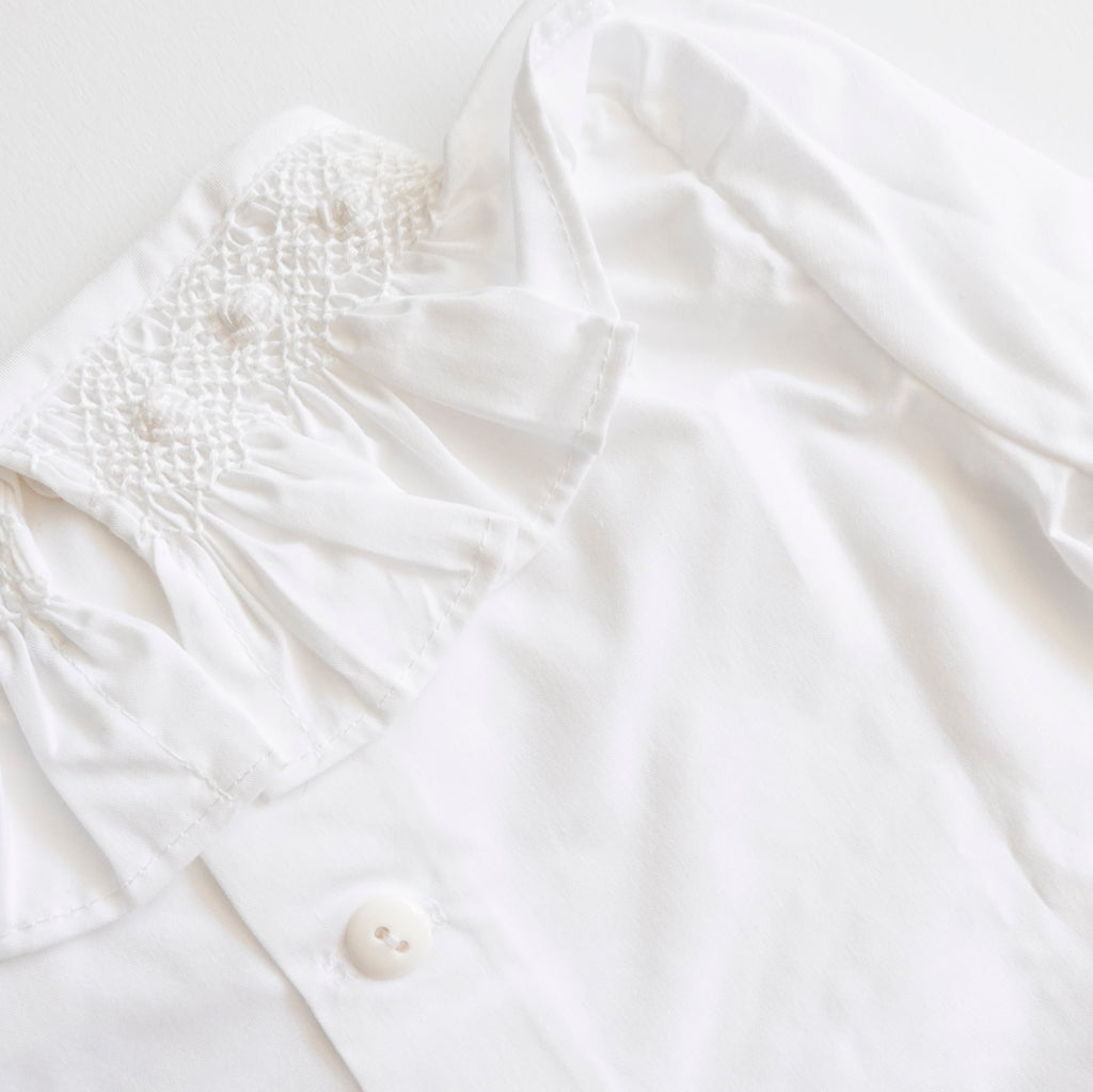Blusa punto smock Aguila manga larga